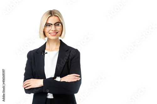 young blonde news commentator with crossed arms looking away isolated on white photo