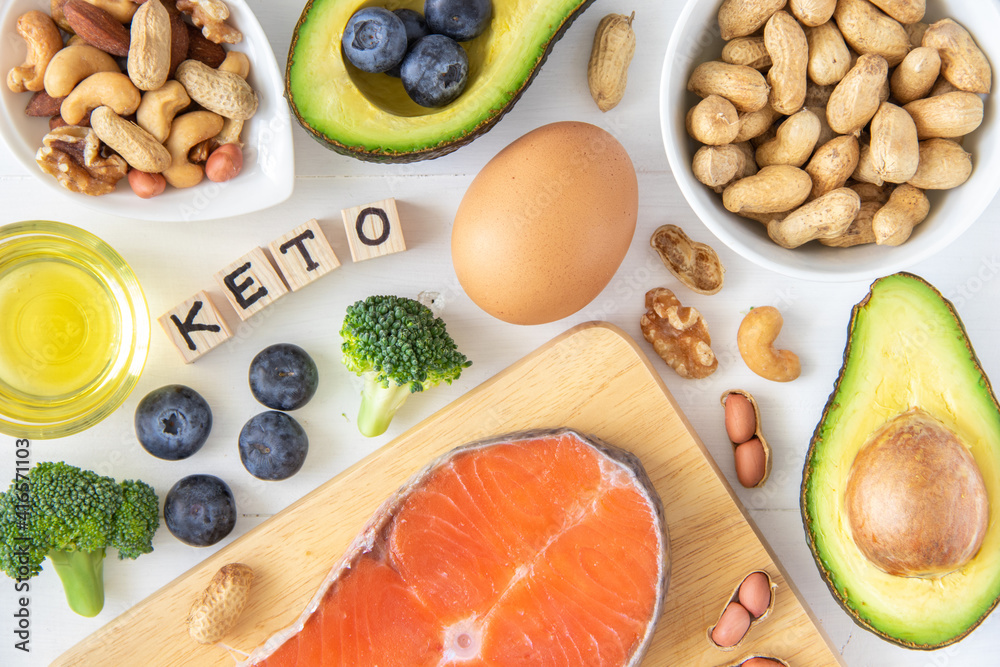 Top view of keto or ketogenic diet on white wooden background, low carb eating with high protein and good fat source Top view of keto or ketogenic diet on white wooden background, low carb eating with high protein and good fat source