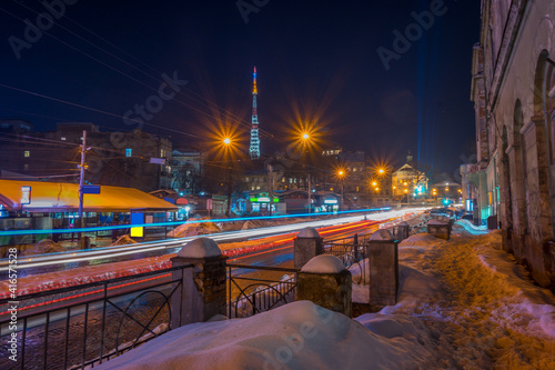 Night Lviv old city architecture in the winter season. Buildings highlighted by the illumination