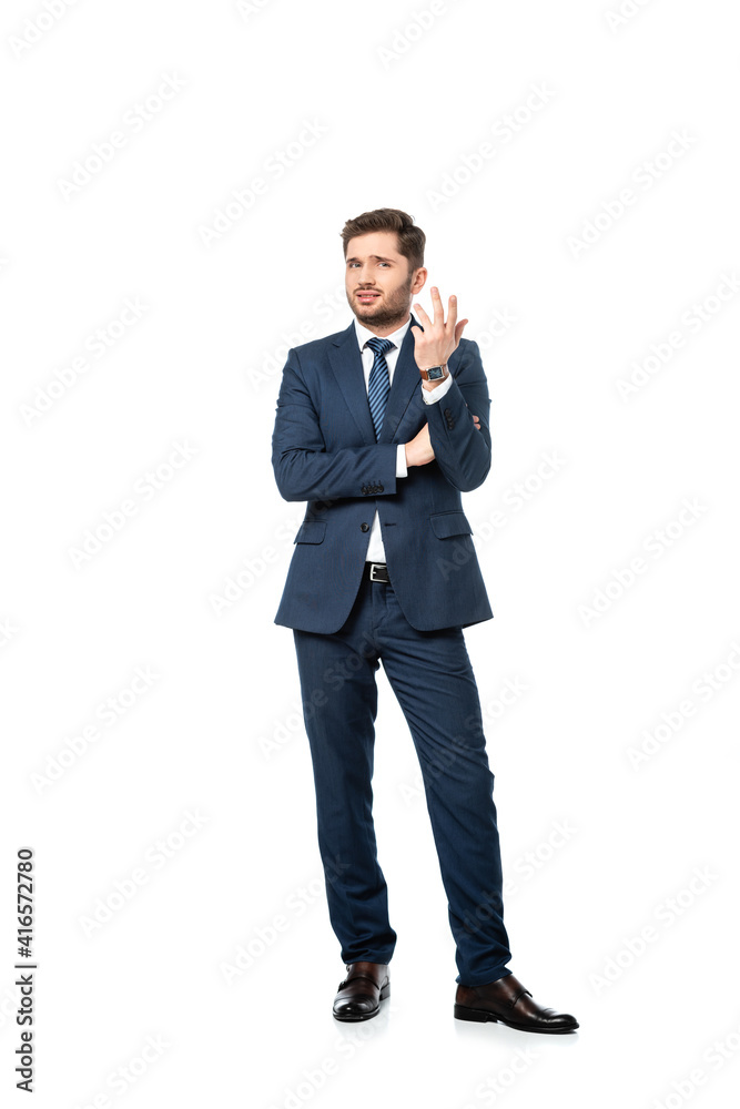 full length view of discouraged businessman looking at camera on white full length view of discouraged businessman looking at camera on white