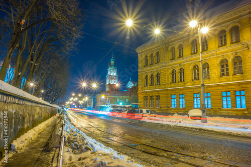 Night Lviv old city architecture in the winter season. Buildings highlighted by the illumination