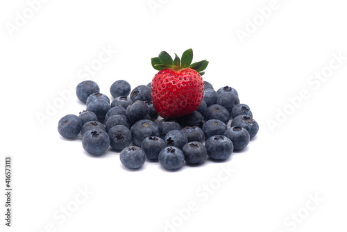 Composition of blueberries and strawberry on a white background
