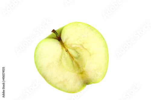 A green apple with a shadow on a white background is isolated
