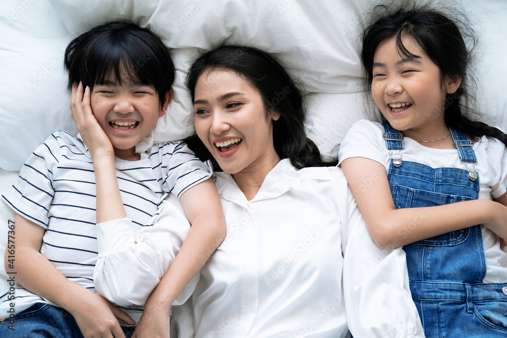 Happy Asian family spending time together at home. Happy Asian family spending time together at home.