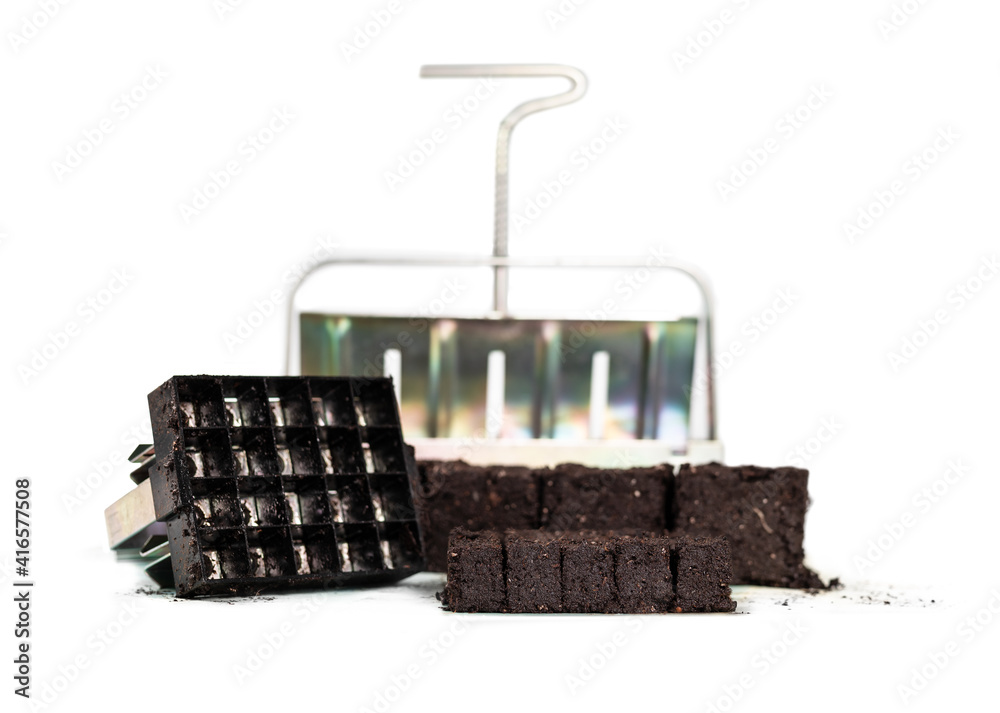 Handheld soil block maker in 2 sizes with compressed potting soil