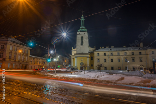 Night Lviv old city architecture in the winter season. Buildings highlighted by the illumination