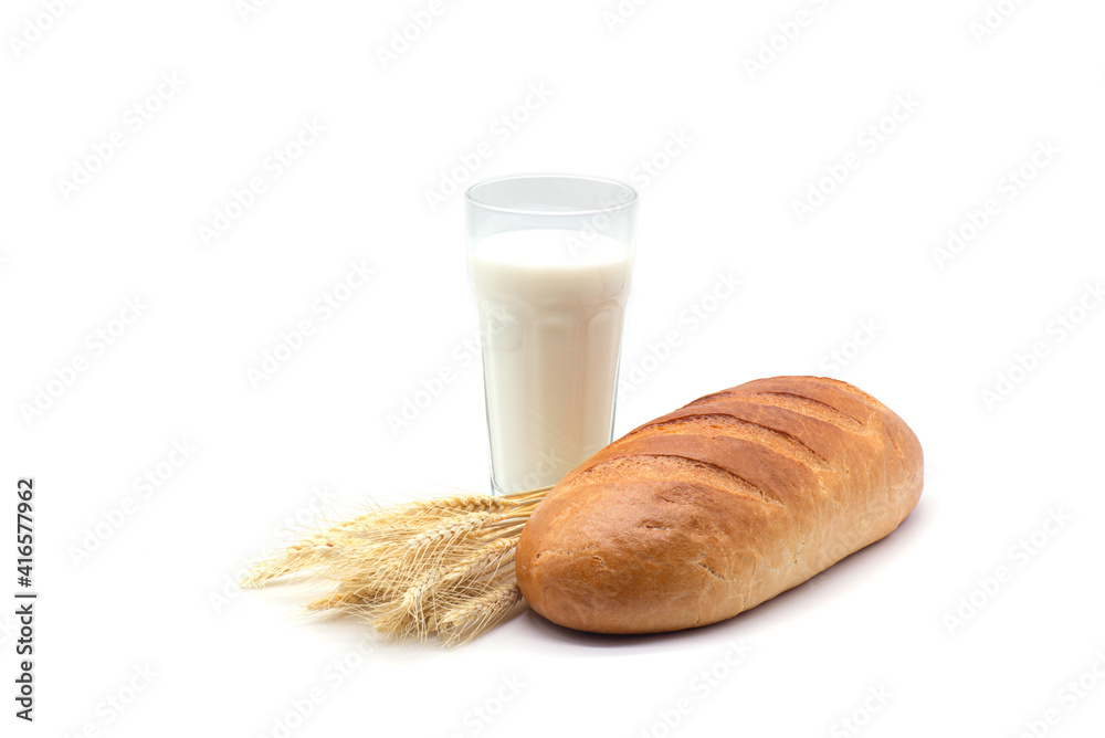Composition of glass of milk, white bread and wheat on a white background