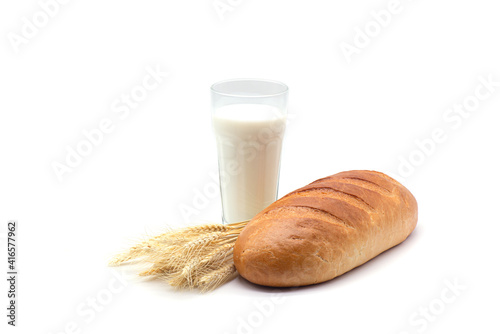 Obraz na płótnie Composition of glass of milk, white bread and wheat on a white background w salonie
