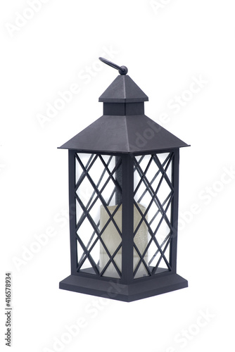 Obraz na płótnie Glass lamp with a candle inside on a white background w salonie