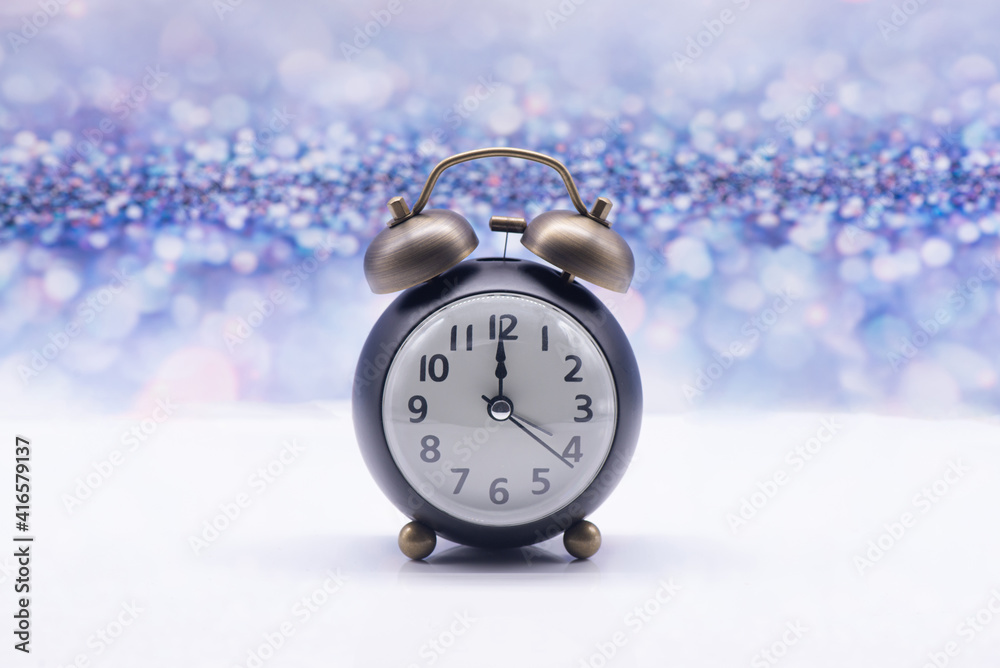Retro alarm clock on a festive background