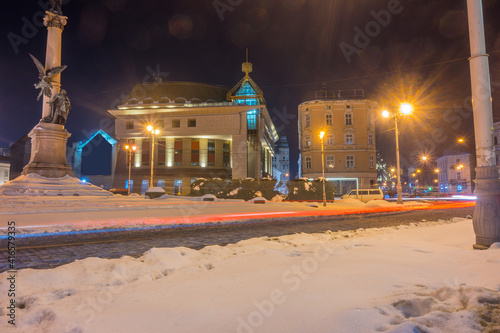 Night Lviv old city architecture in the winter season. Buildings highlighted by the illumination