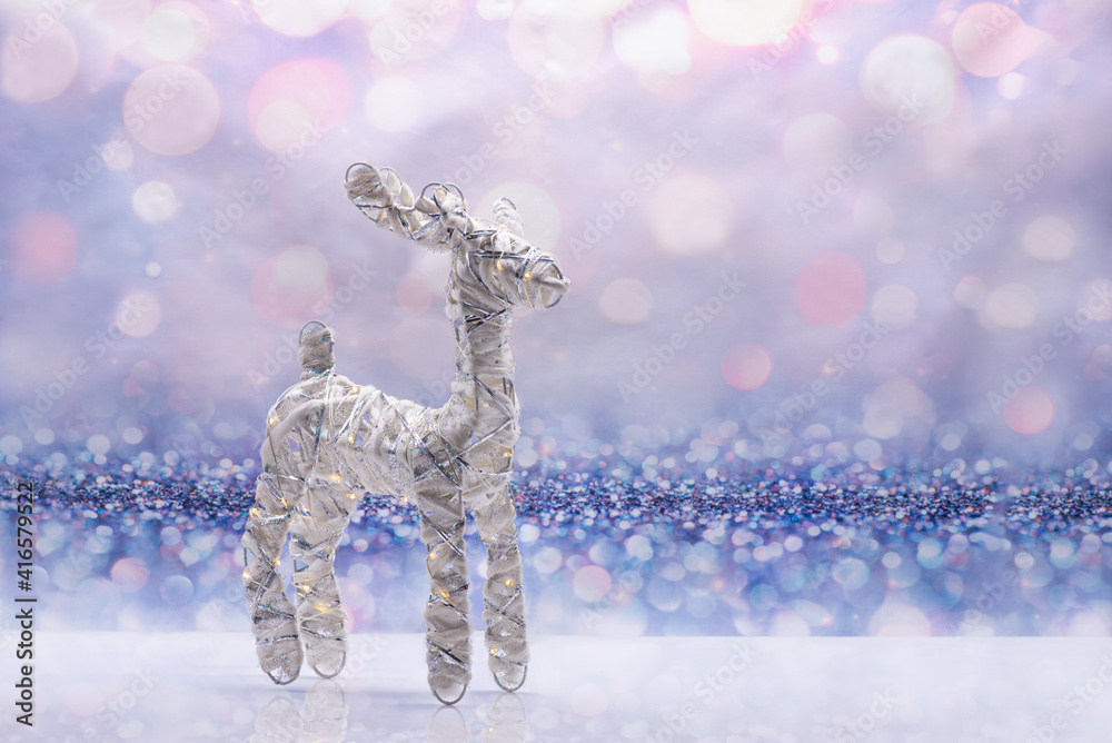 Glowing deer on a festive background. Christmas Concept
