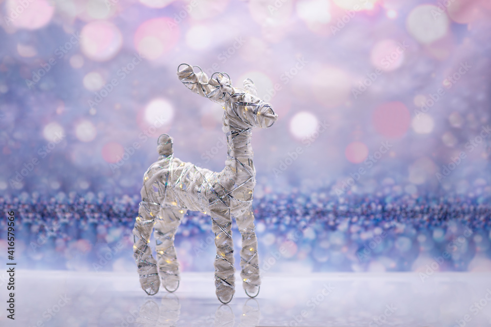 Glowing deer on a festive background. Christmas Concept