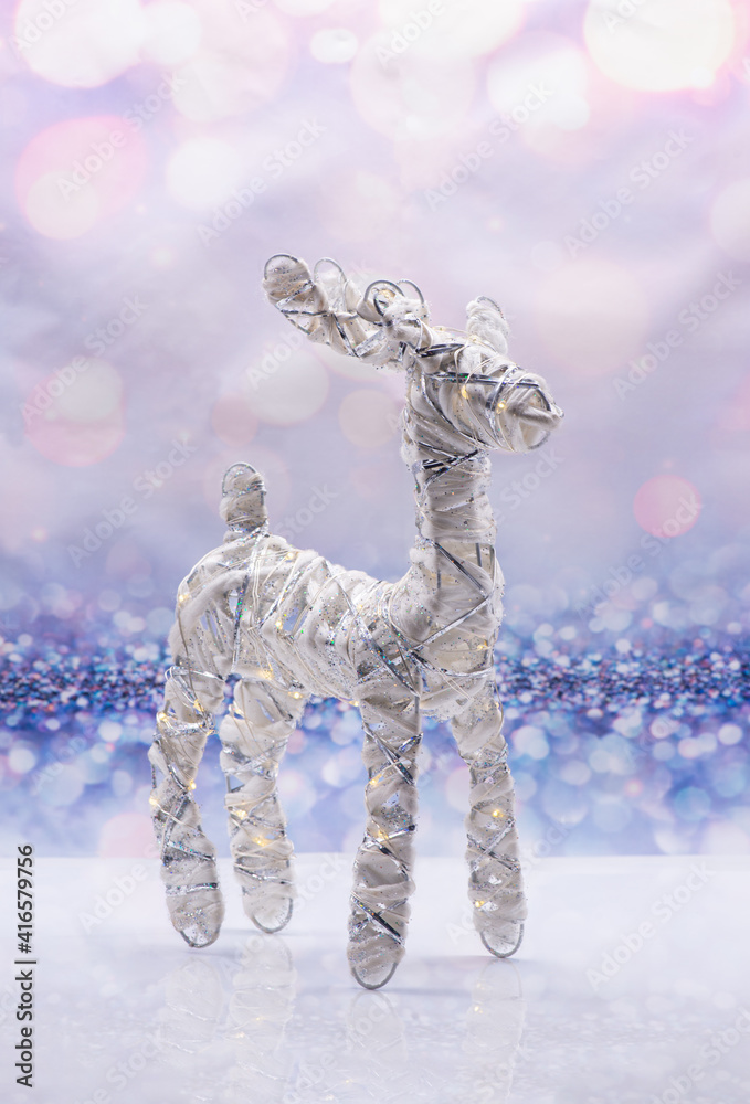 Glowing deer on a festive background. Christmas Concept