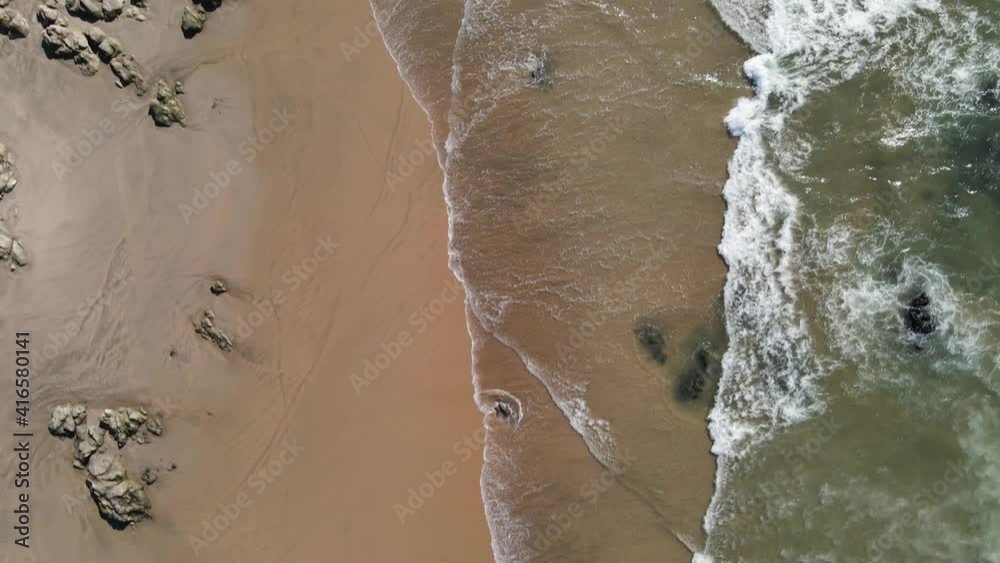 Top down view of a empty beach with rocks Top down view of a empty beach with rocks