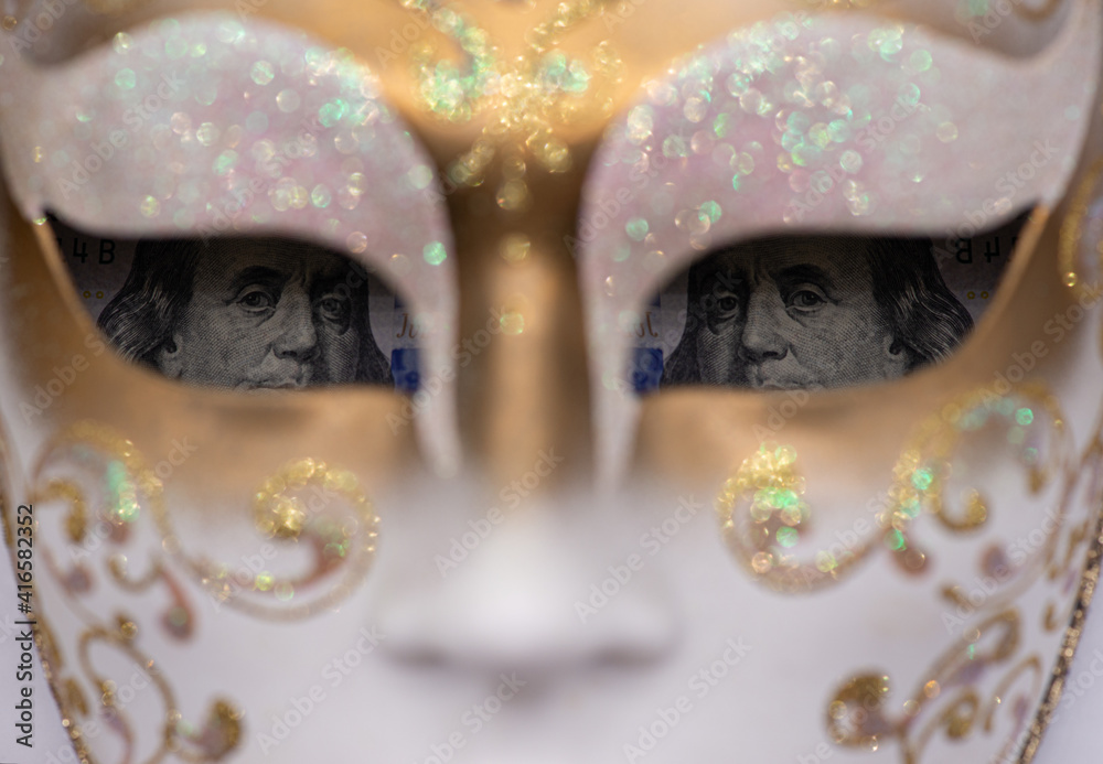 Benjamin Franklin, pictured on the $ 100 bill, in the eyes of the Venetian mask