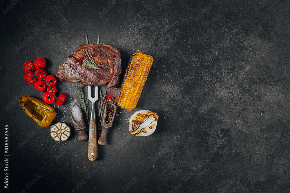 barbeque steak on a black slate board