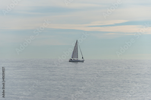 Sailing boat on the Black Sea at sunset in Sochi, Russia