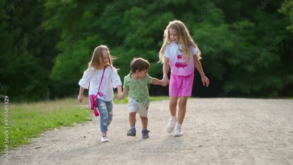 Children playing in park. Happy children kid relaxing together in the park Children playing in park. Happy children kid relaxing together in the park