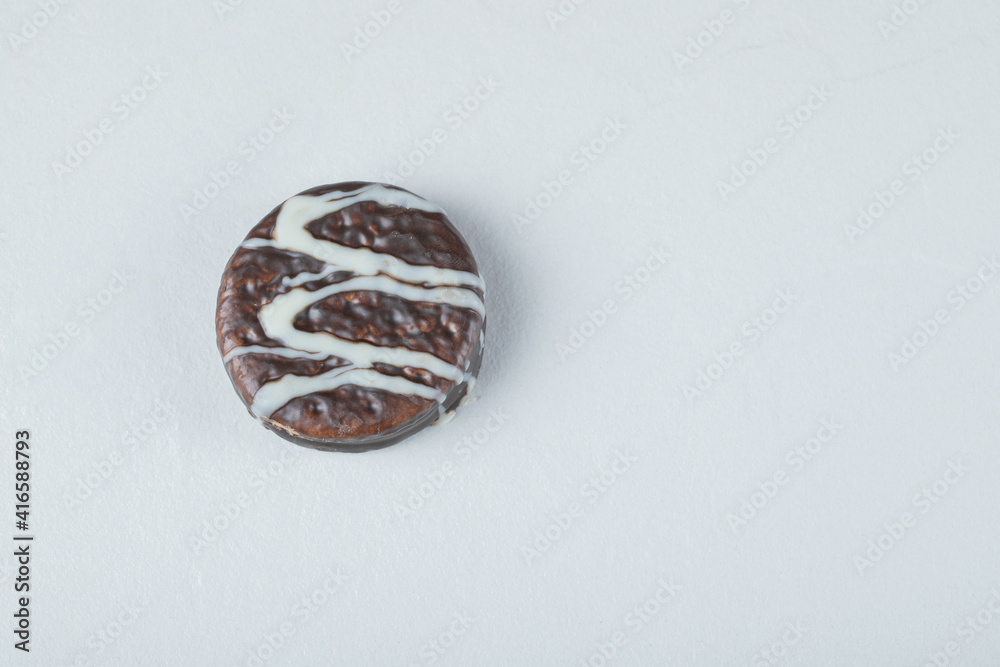 Chocolate waffle cookies with white cream on a white background Chocolate waffle cookies with white cream on a white background