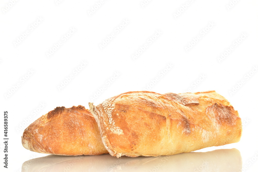 Two delicious freshly baked French baguette halves, close-up, isolated on white.