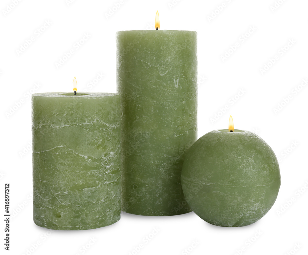 New wax candles on white background. Interior elements New wax candles on white background. Interior elements