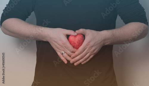 Fototapeta Naklejka Na Ścianę i Meble -  Man holding red heart, health insurance, donation charity concept, heart care.