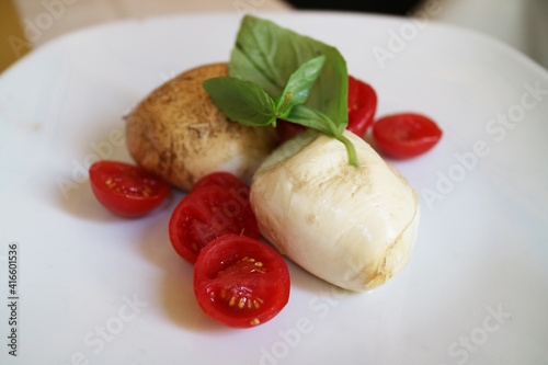 fried buffalo cheese with cherry tomato food plate