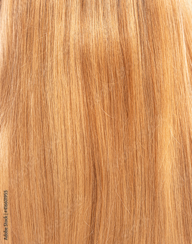 Blond female hair as background close up.