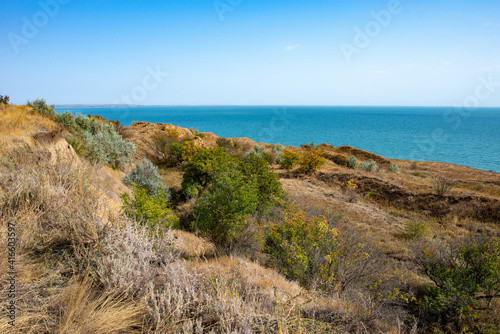 Hilly slope against the background of the sea