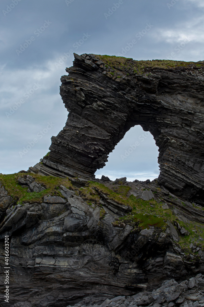 Kirkeporten- famous landmark and rock formation in Northern Norway at Magerøya island