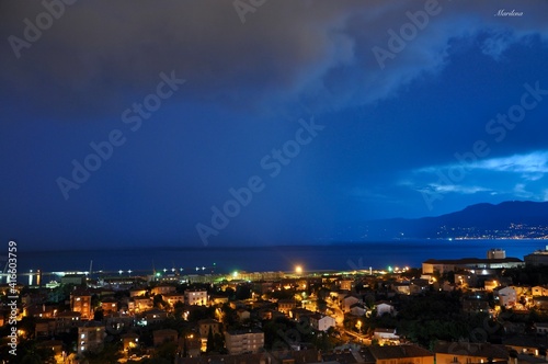 Storm clouds and rain over Rijeka city Croatia with a piece of sky