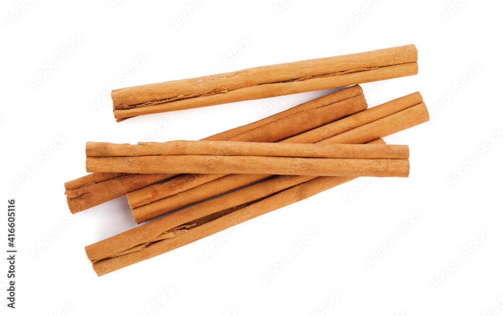 Aromatic dry cinnamon sticks on white background, top view Aromatic dry cinnamon sticks on white background, top view
