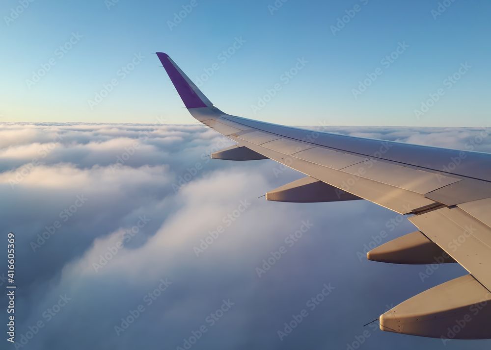 Obraz premium View from a airplane window on the beautiful sunset sky