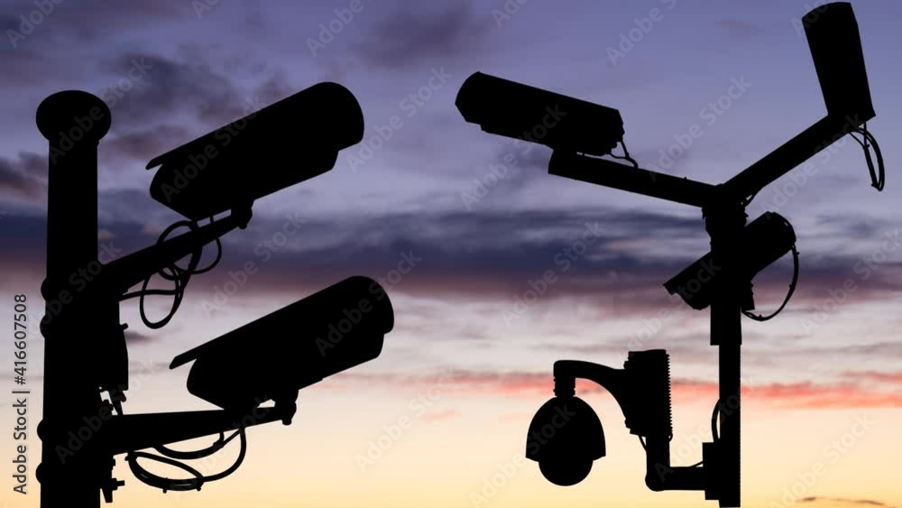 Surveillance Cameras in Silhouette at Twilight, Time Lapse with Colorful Sky