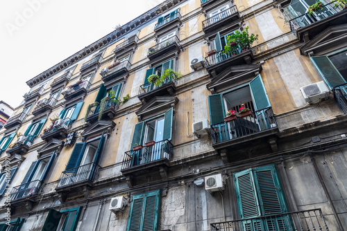 Facade of an old classic building in Naples, Italy