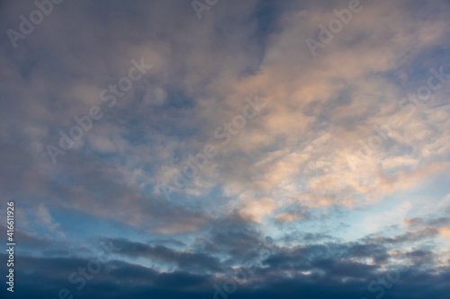 Blue and orange high layered winter sunset cold epic clouds on sky. Heaven cloudscape air view