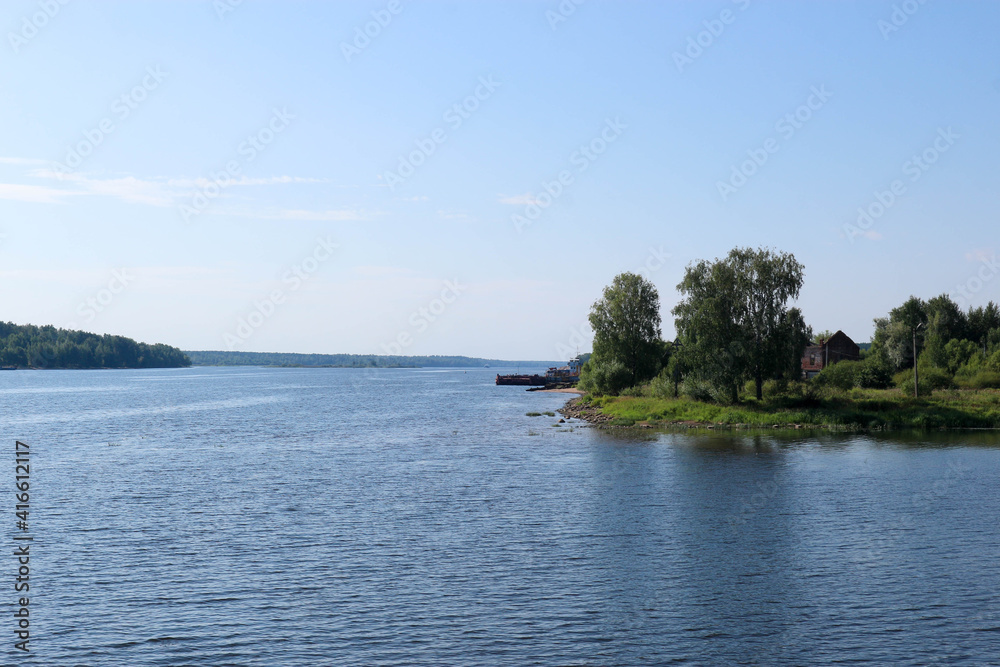 summer aerial view from the coast to the water surface of the Volga river in Russia