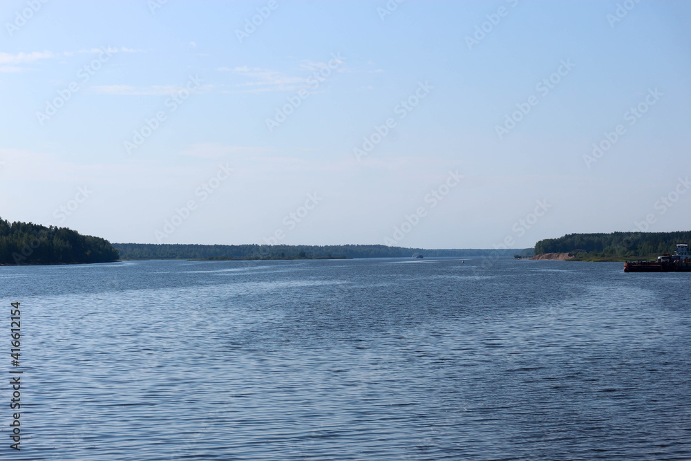 summer aerial view from the coast to the water surface of the Volga river in Russia summer aerial view from the coast to the water surface of the Volga river in Russia