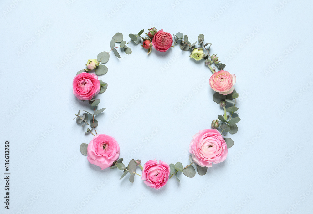 Frame of beautiful ranunculus flowers on light blue background, flat lay. Space for text Frame of beautiful ranunculus flowers on light blue background, flat lay. Space for text