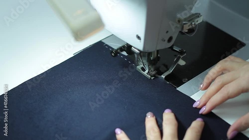 Sewing production. Machine for stitching on fabric.