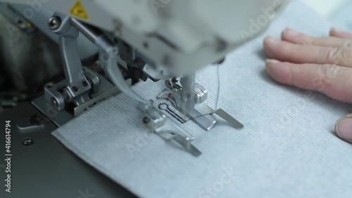Sewing production. Machine for stitching on fabric.