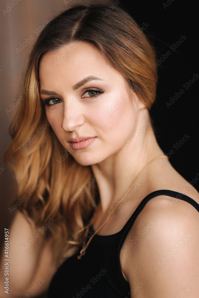 Closeup portrait of attractive young woman with evening makeup Closeup portrait of attractive young woman with evening makeup