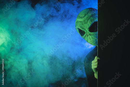 The alien is looking out from a wall concept.