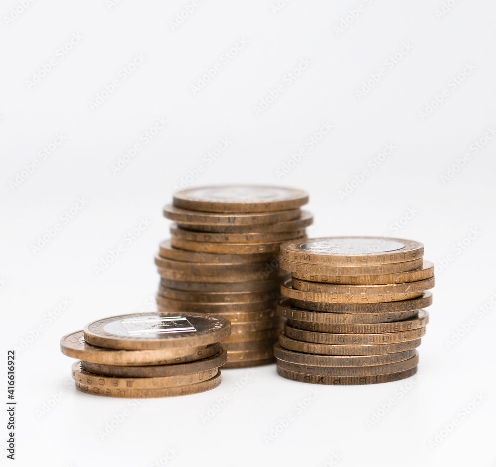 isolated stacks of coins on the white background isolated stacks of coins on the white background