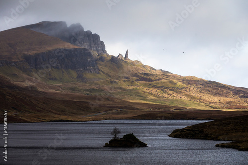 Loch Leathan and Old man of Storr rock formations, Isle of Skye, Scotland. Concept: typical Scottish landscape, tranquility and serenity, particular morphologies. photo