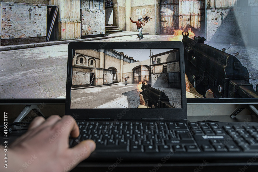 PC gaming. Playing Counter Strike: Global Offensive video game on computer.  CS: GO Photos | Adobe Stock