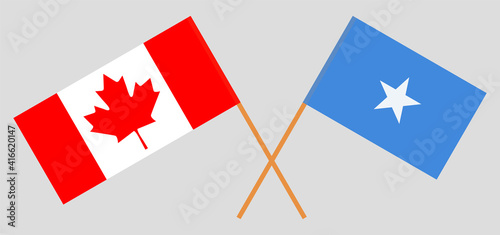 Crossed flags of Canada and Somalia. Official colors. Correct proportion