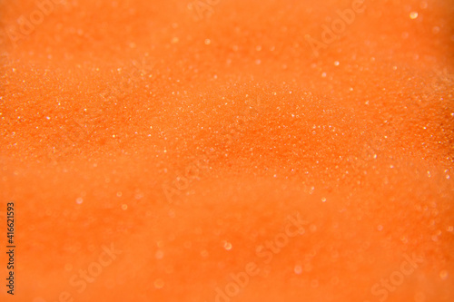 Texture of a yellow washcloth close-up. Macro shooting. Photo taken at an angle of 45 degrees