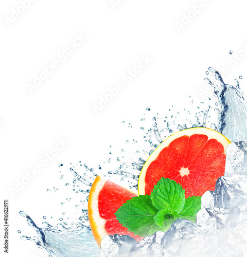 grapefruit splash with water and ice cubes isolated on white background